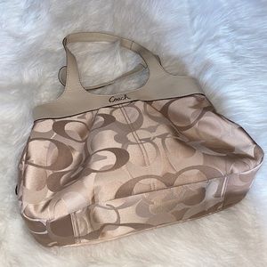 Cream colored Coach logo purse